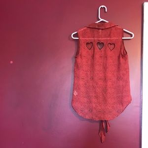 Sleeveless button up shirt with heart cutouts